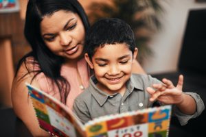 Mom reading to son